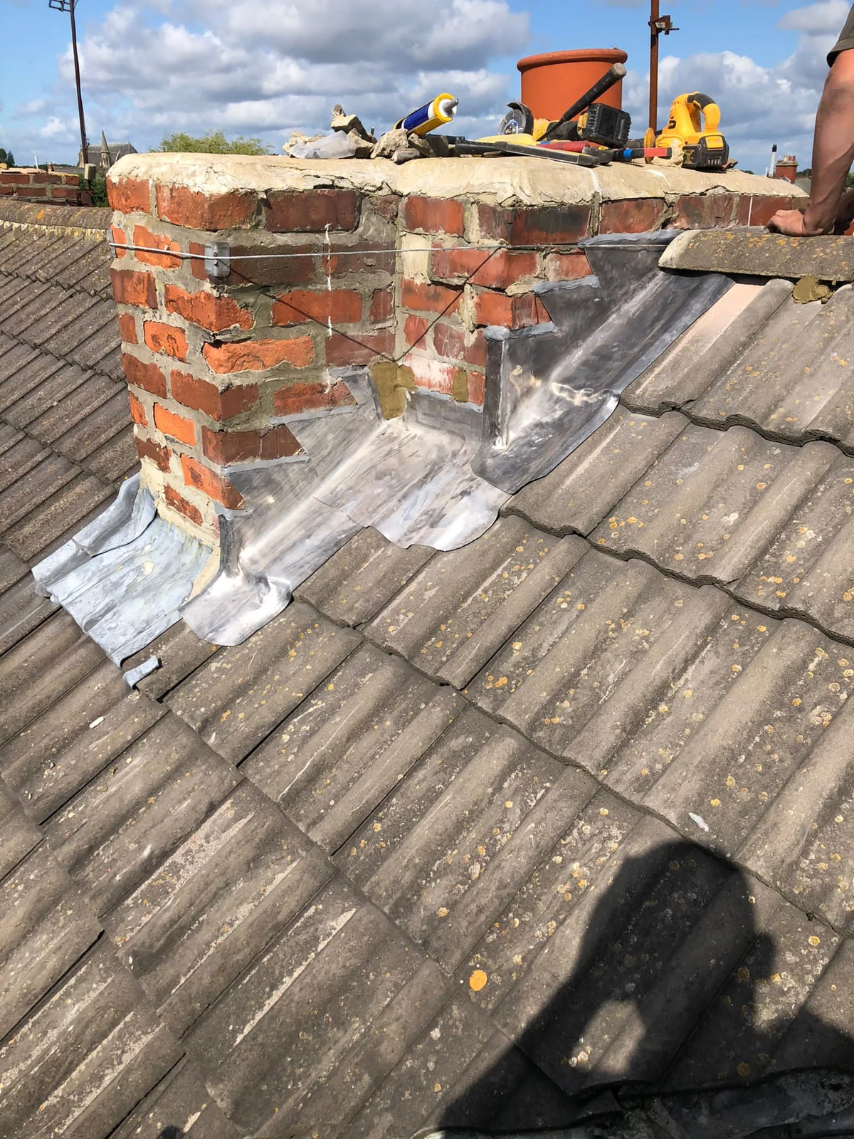Lead flashing around another face of the chimney