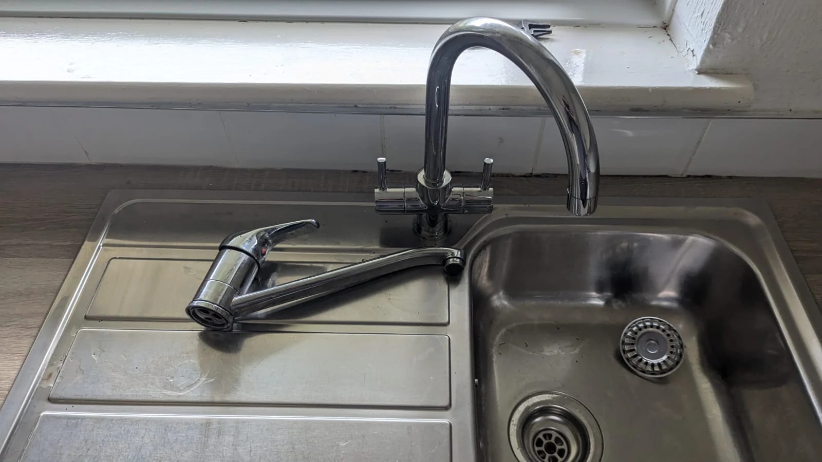 Kitchen tap during the replacement work