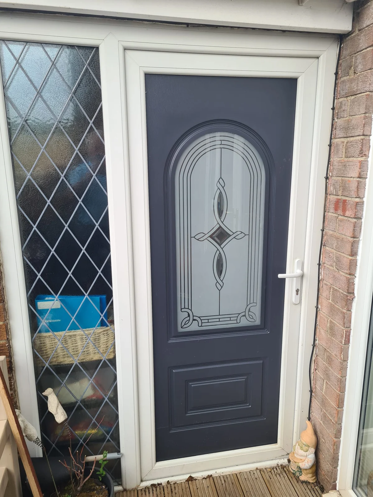 Second reused uPVC door set with decorative glazing and white frame
