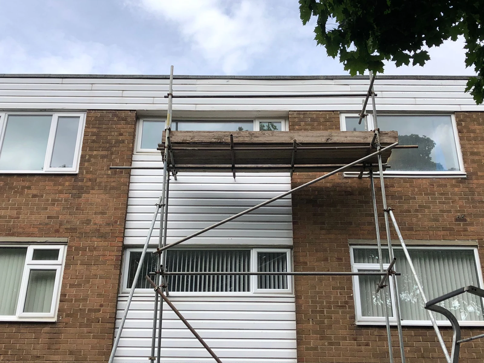 White external cladding and access scaffold at the Newcastle block